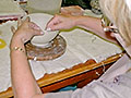 Hand-coiling a pot