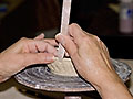 Hand-coiled pot on the wheel